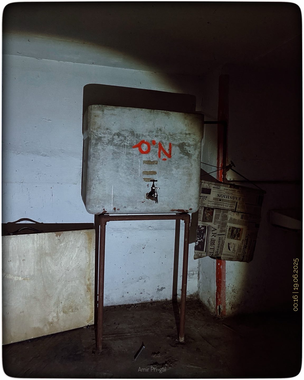 A water tank that was put into the shelter in 1975 #LifeUnderThreat #ShelteringTogether #EverydayIsrael #HumanMoments #ConflictAndRoutine #BehindTheHeadline #Photojournalism #DocumentaryPhotography #MiddleEastTensions #SilentStrength #InTheShelter #MomentsThatMatter #UncertainTimes #LifeInIsrael #ThroughMyLens
